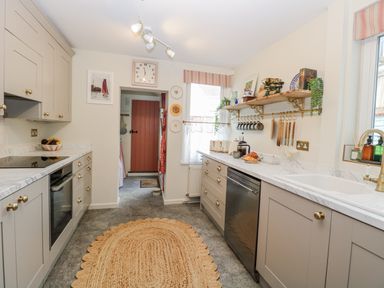 A kitchen with cabinets and a sink at 18 Pakefield Road in Lowestoft