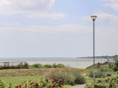 A view of the sea with flowers and a lamp post at 18 Pakefield Road in Lowestoft