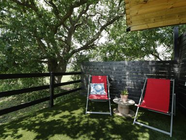 An outdoor space with two chairs and a table in Shepherd Hut’s, Bristol