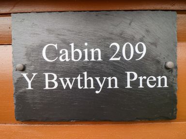 A sign displaying Cabin 209 and Y Bwthyn Pren at Y Bwthyn Pren, Cabin 209, Trawsfynydd