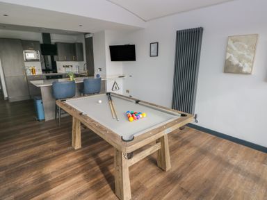 A game room featuring a pool table and kitchen units at 10 Brython Place Tackley