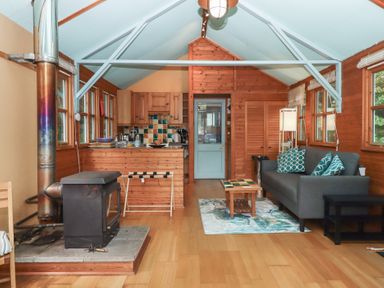 A living room with a sofa and coffee table at The Boat House in Ashprington
