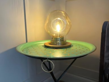 A side table with a lamp in a living room at Craster House in Seahouses