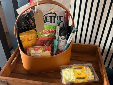 A basket with snacks and drinks at Craster House in Seahouses