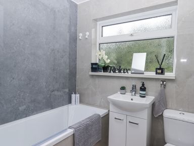 A bathroom with bathtub and sink at Milana in Tiverton