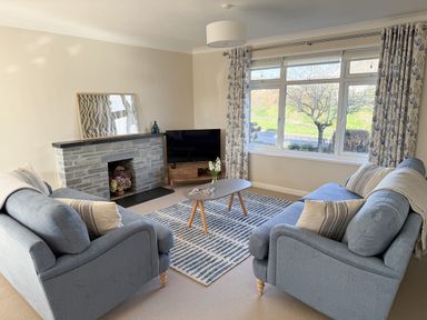 A living room with sofas and a coffee table at 42 Little Trelyn, Rock