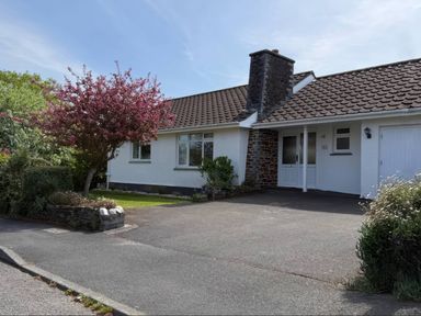 A house with a driveway and tree at 42 Little Trelyn in Rock