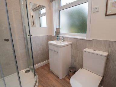 A bathroom with a shower, sink, and toilet at Iveridge in Sandsend