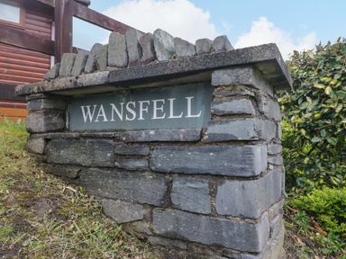 A stone sign with WANSFELL at Wansfell 2 in Limefitt Park near Troutbeck