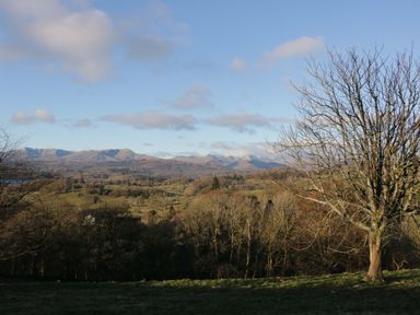 A landscape with mountains and trees at Wansfell 2 Limefitt Park near Troutbeck