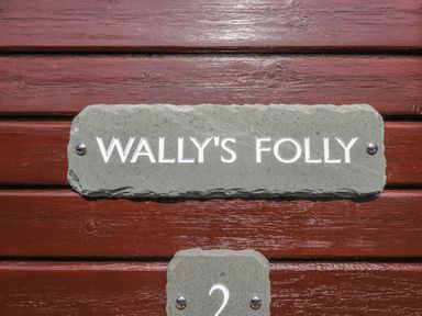 A sign displaying Wally's Folly at Limefitt Park near Troutbeck