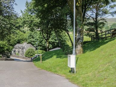 A house with a walkway and trees at Wally's Folly near Limefitt Park