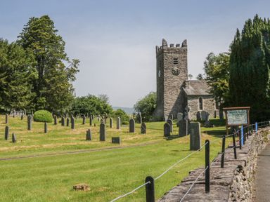 An outdoor view of a church with a graveyard at Wally's Folly near Limefitt Park