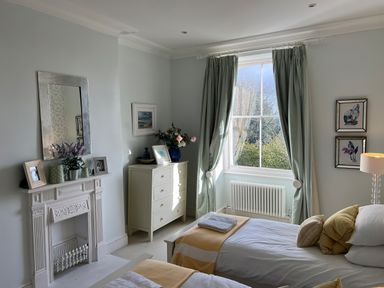 A bedroom with two beds and a window at Trenare in Truro