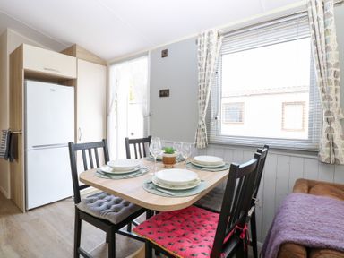 A dining area with a table and chairs at Number 34 Foxburrow Hang in Great Yarmouth