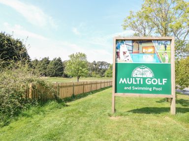 A sign for Multi Golf and Swimming Pool at Number 34 Foxburrow Hang in Great Yarmouth
