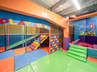 An indoor children's play area with padded floors, colorful climbing structures and a soft play zone at Starlight Skylight - Billing Aquadrome Holiday Park