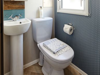 A bathroom with a sink and toilet at Island Breeze - Hayling Island