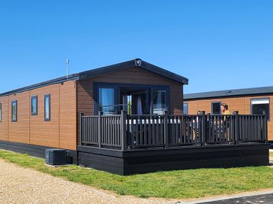 A vacation home with decking at Wave Whisperers - Hayling Island