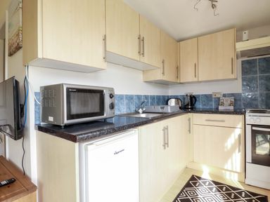 A kitchen with appliances on a countertop at 101 Atlantic Bays Holiday Park in Padstow