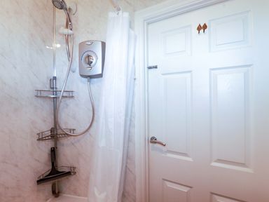 A shower with a shower head and valve in a bathroom at 101 Atlantic Bays Holiday Park in Padstow