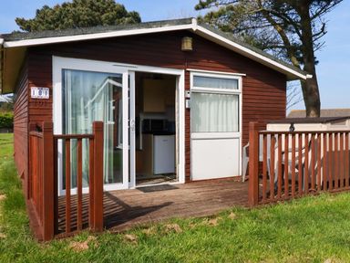 A cabin with a deck and outdoor access at 101 Atlantic Bays Holiday Park in Padstow