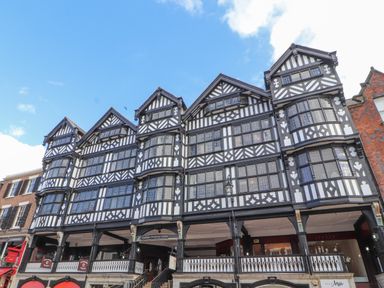 A historic building with multiple windows and balconies at The Garden Hut in Wrexham