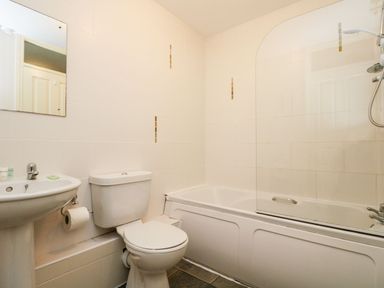 A bathroom with a toilet sink bathtub and shower at Valley Lodge 31 in St Ann's Chapel Cornwall