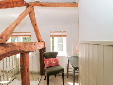 An office space with a chair and desk at Old Farm Cottage in Warminster