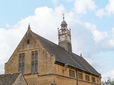 A building with a clock tower at Elm Cottage Moreton-In-Marsh