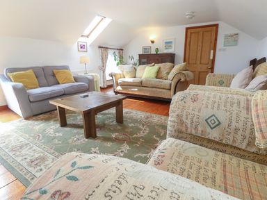 A living room with sofas and a coffee table at The Cottage in St. Ives