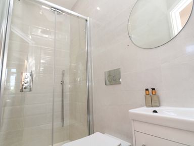 A bathroom with shower, toilet, and sink at Carn Brea in Redruth