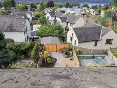 An outdoor view of houses and gardens at Stoker’s Cottage in Bowness-On-Windermere