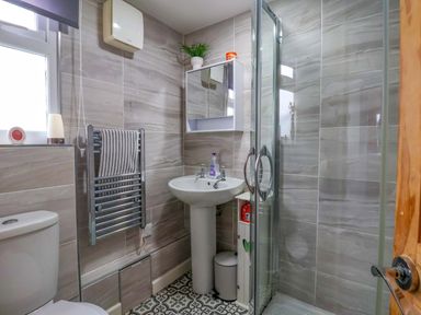 A bathroom with a sink and shower at Chalet 231 in Bridlington