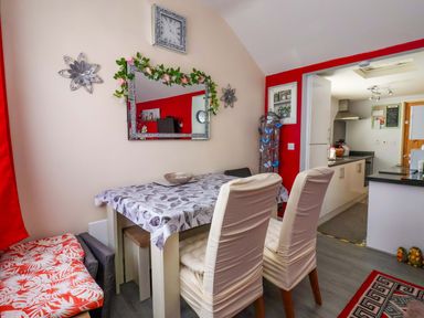 A dining room with a table and chairs at Sandbay in Bridlington