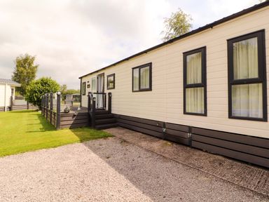 A mobile home with garden area at 22 Yealand in Carnforth