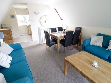 A dining room with a table and chairs at Valley Lodge 2 in Callington