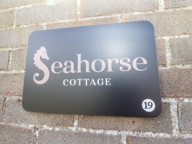 A sign with Seahorse Cottage located at number 19 in Chathill