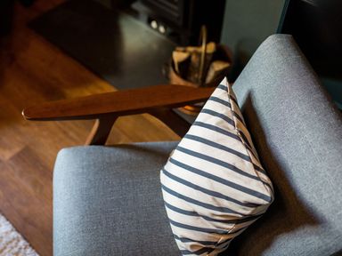 A chair with a pillow in a living room at Grove House in Grange-Over-Sands