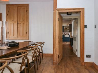 A dining room with a table and chairs at Grove House in Grange-Over-Sands