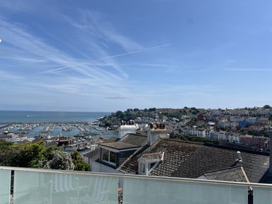 A view of a harbor with boats and houses at 21 Station Hill
