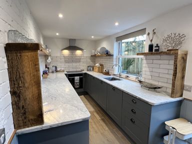 A kitchen with a countertop and sink at Still Waters in Brixham