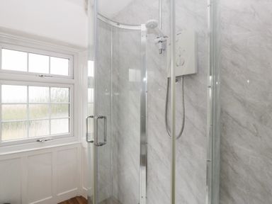 A shower with a window at Penny Farthing Inn Aston Crews near Ross-On-Wye