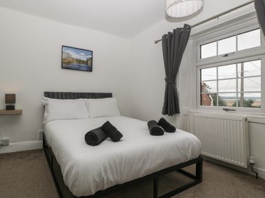 A bedroom with a bed and lamp at Penny Farthing Inn Aston Crews near Ross-On-Wye