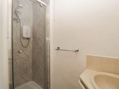 A bathroom with a shower and sink at Penny Farthing Inn Aston Crews near Ross-On-Wye