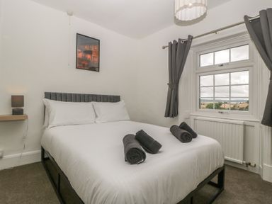 A bedroom with a bed and window at Penny Farthing Inn in Aston Crews near Ross-On-Wye