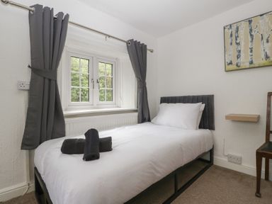 A bedroom with a bed and window at Penny Farthing Inn Aston Crews near Ross-On-Wye