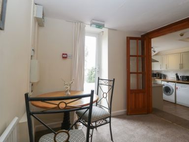 A dining area with a table and chairs at Penny Farthing Inn Aston Crews near Ross-On-Wye