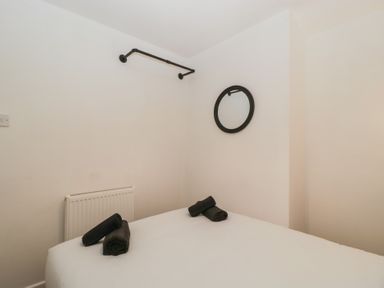 A bedroom with a bed and towels at Penny Farthing Inn Aston Crews near Ross-On-Wye