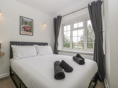 A bedroom with a bed and window at Penny Farthing Inn Aston Crews near Ross-On-Wye